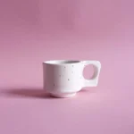 porcelanowa filizanka espresso | espresso porcelain cup | ceramika handmade inspirowana naturą | nordic inspired handmade ceramics | ręcznie robiona ceramika artystyczna | handmade ceramics inspired by the sea | ceramika inspirowana nordyckim wybrzeżem | nordic coastal ceramics | ceramika inspirowana oceanem | ceramics inspired by northern landscapes | unikatowa ceramika handmade | slow design handmade ceramics | ceramika z naturalną fakturą | textured handmade ceramics | ceramika użytkowa handmade | functional handmade ceramics | ceramika inspirowana lofotami | nordic sea inspired ceramics | nowa kolekcja ceramiki handmade | artisanal ceramic collection | ceramika z duszą | ceramics made slowly by hand | pantone cloud dancer | vogue living